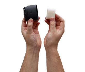 Hands holding the BOB applicator and a refill bar